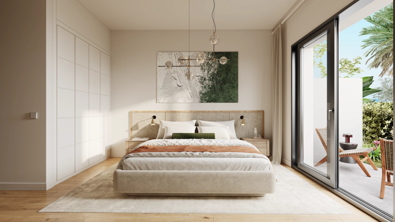 Ein ruhiges Hauptschlafzimmer, entworfen für Ruhe und Entspannung, mit direktem Zugang zu einem Außenbereich.