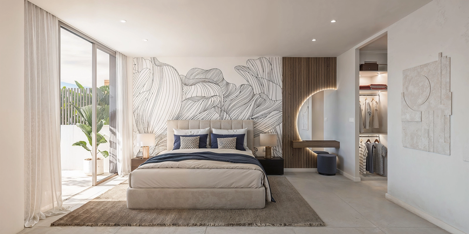 Das elegante Hauptschlafzimmer bietet einen privaten Rückzugsort mit direktem Zugang nach draußen und einem begehbaren Kleiderschrank.