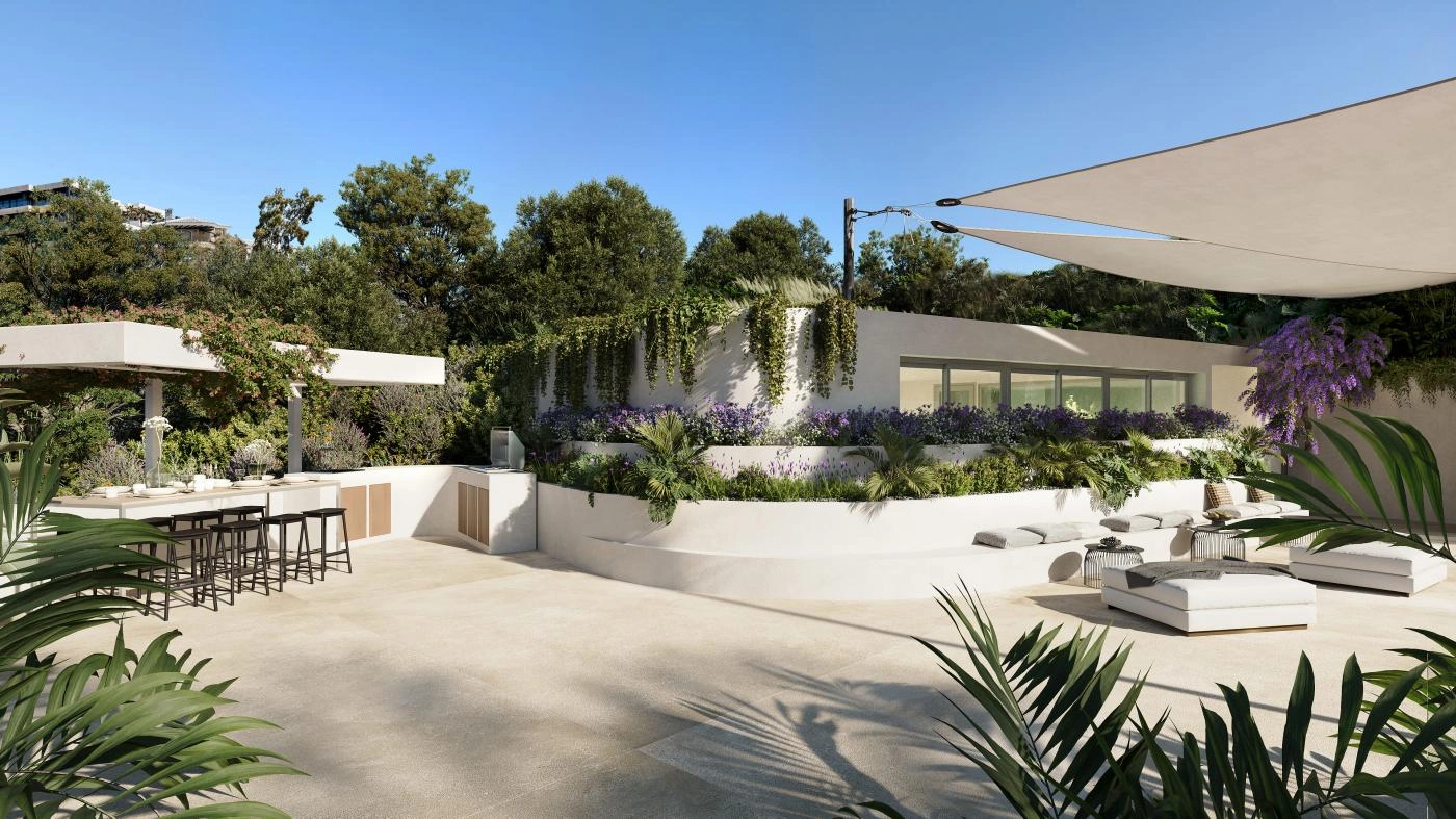 Ein Außen-Lounge-Bereich und eine Küche mit Grillplatz, perfekt für gesellige Zusammenkünfte und Essen im Freien.