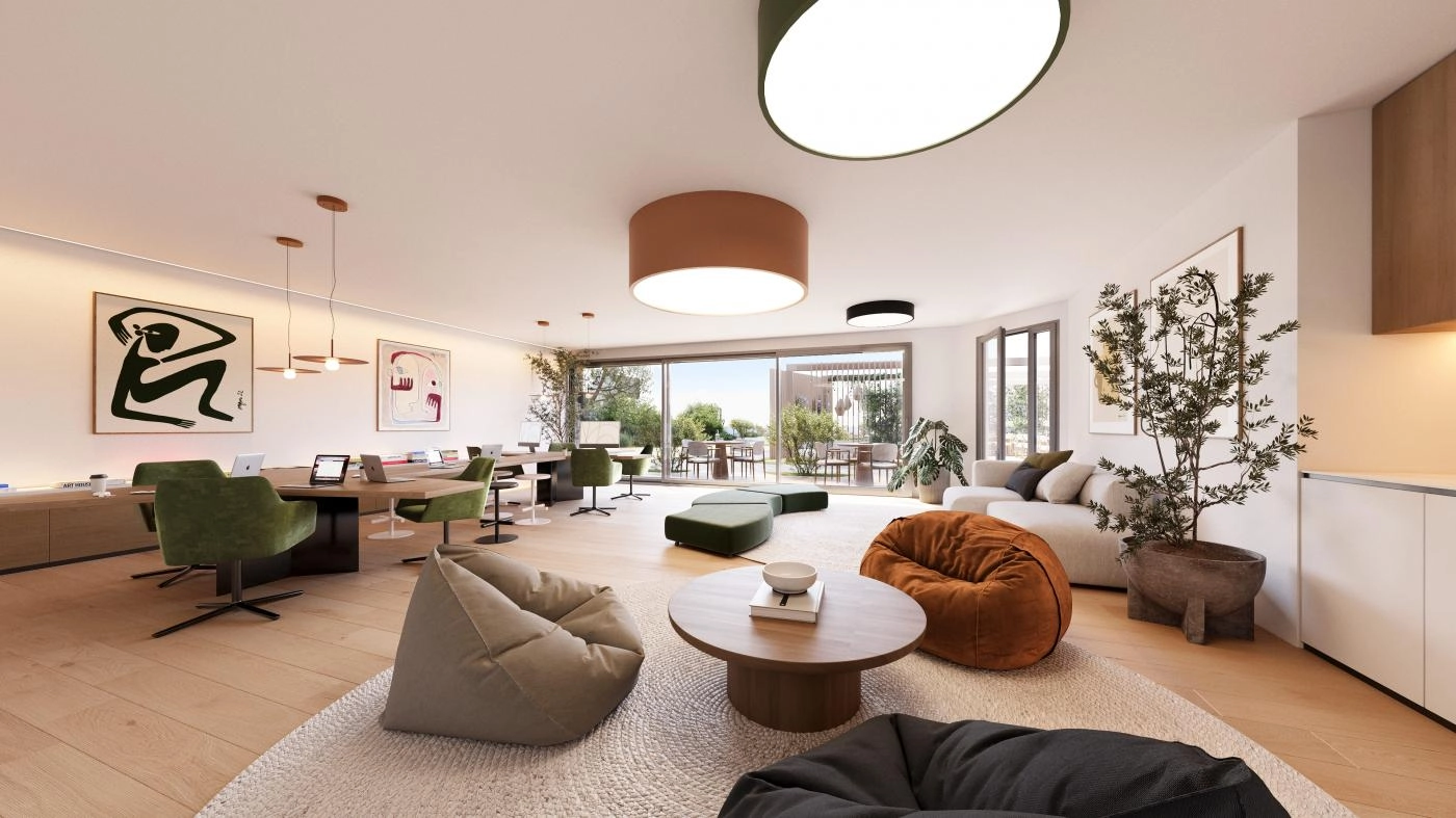 Eine vielseitige und stilvolle Co-Working- und Social-Lounge, in der die Bewohner bequem arbeiten, sich treffen oder entspannen können.