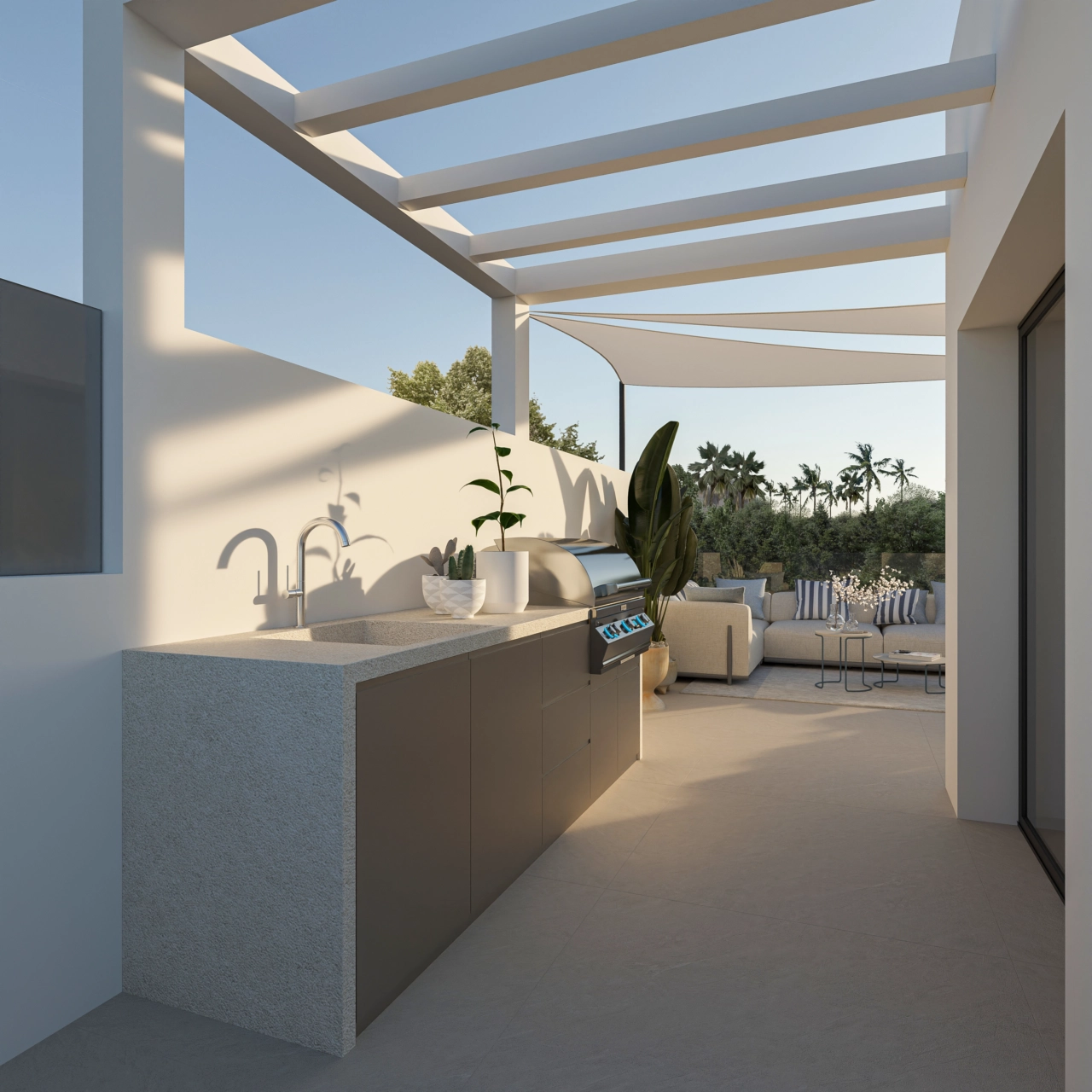 Die Terrasse verfügt über eine hochwertige Außenküche, ideal für Mahlzeiten im Freien.