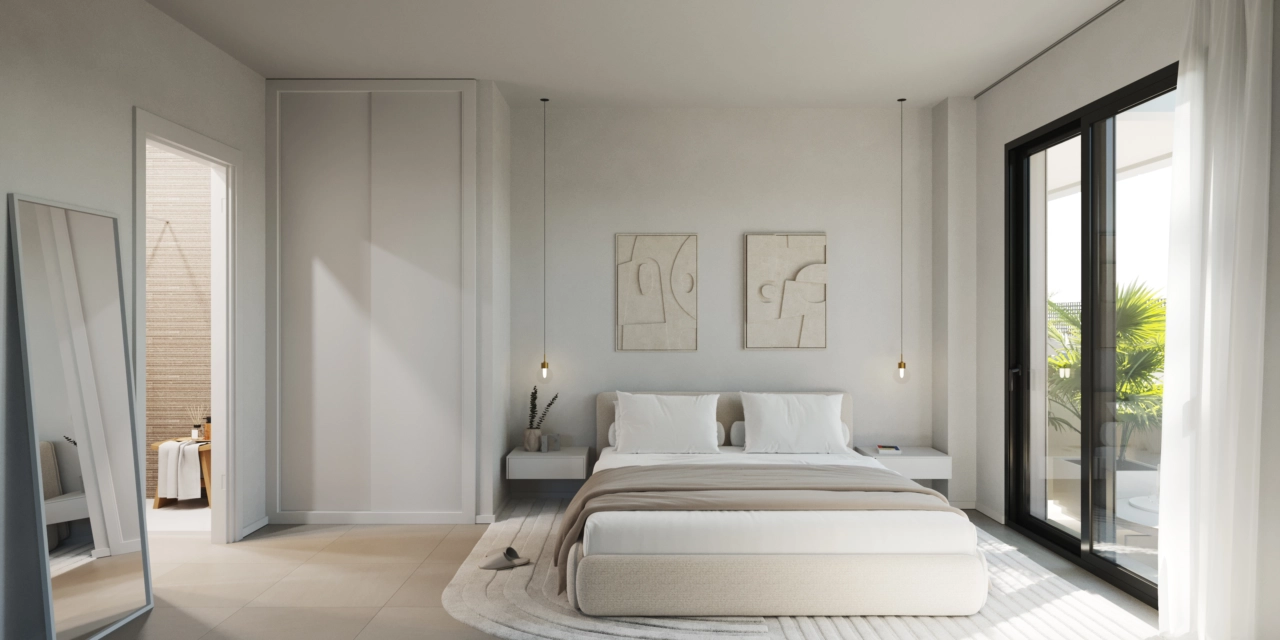 Das Hauptschlafzimmer bietet einen ruhigen Rückzugsort mit direktem Zugang zur Terrasse.