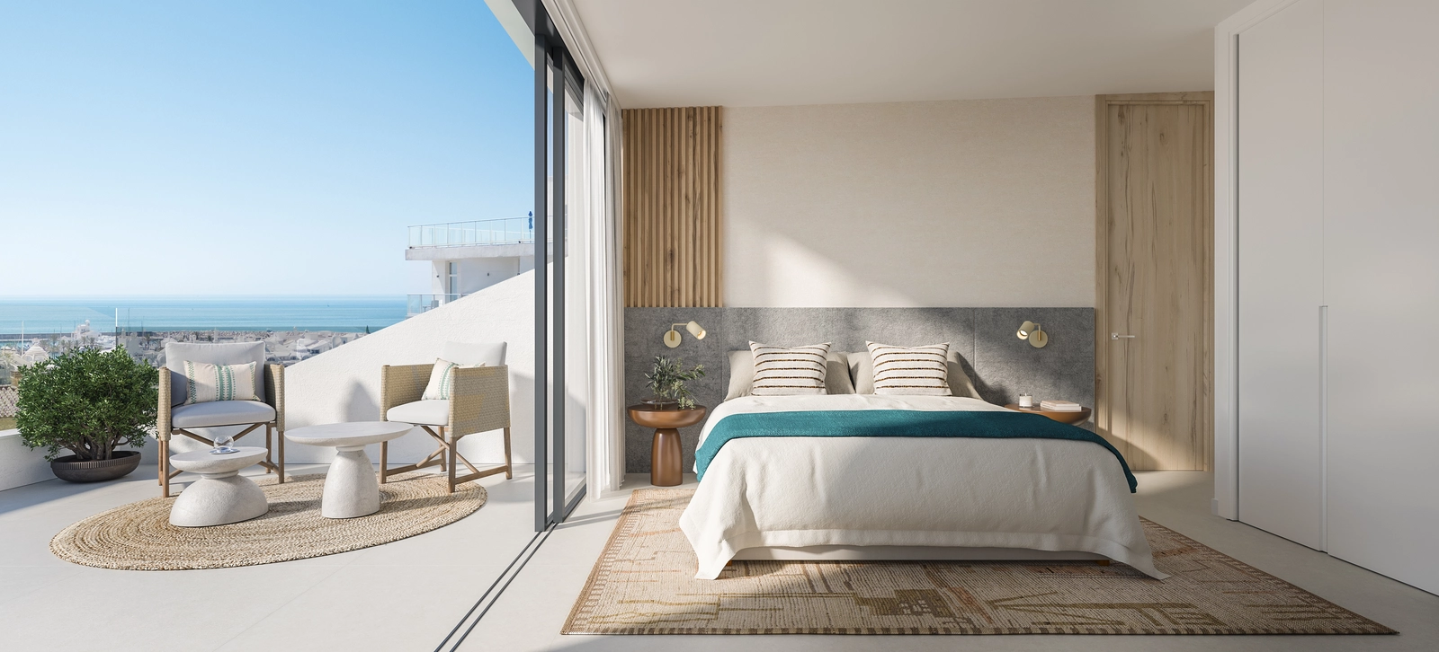 Ein helles und ruhiges Schlafzimmer mit direktem Zugang zu einer Terrasse mit wunderschönem Meerblick.