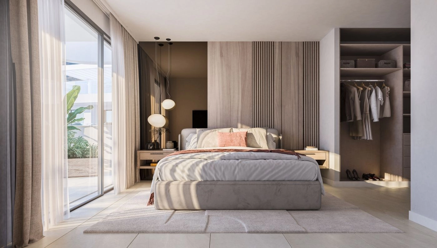 Ein ruhiges Hauptschlafzimmer mit elegantem Design, viel Stauraum und direktem Zugang zu einer privaten Terrasse.