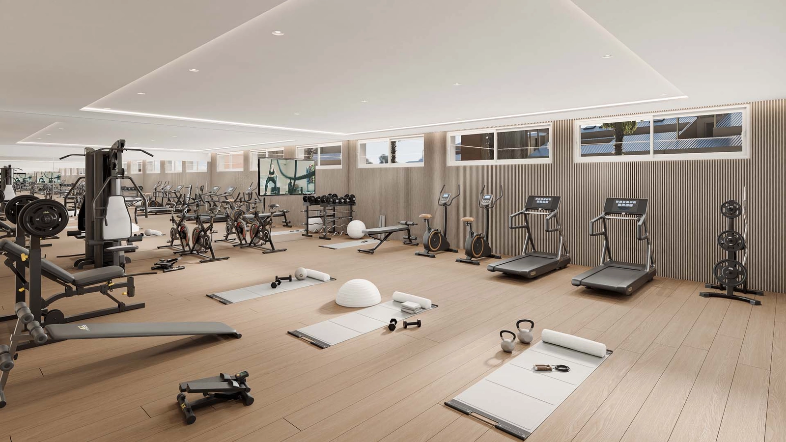 Ein voll ausgestatteter, hochmoderner Fitnessraum für die Fitness und das Wohlbefinden der Bewohner.