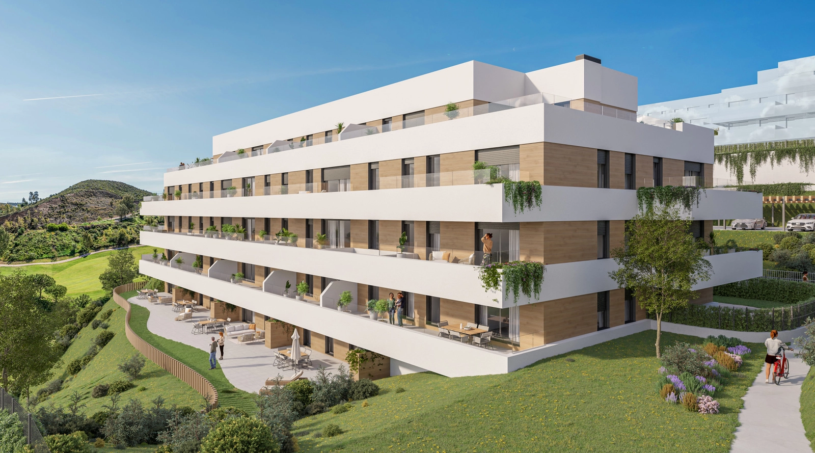 Die moderne Architektur der Residenzen, mit Blick auf die üppig grüne Landschaft des Golfplatzes.