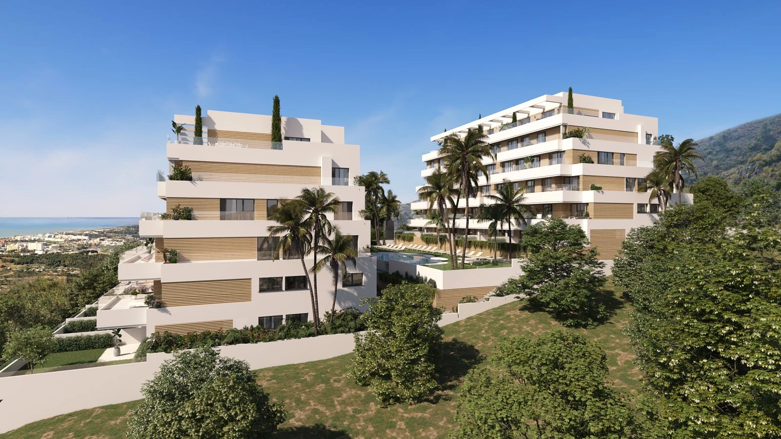 Ein erhöhter Blick auf die moderne Wohnanlage, die ihre beeindruckende Architektur und den Blick auf das Mittelmeer zeigt.
