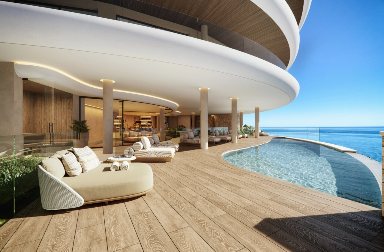 Das elegante Gemeinschafts-Infinity-Pooldeck, eine perfekte Oase der Entspannung mit endlosem Meerblick.