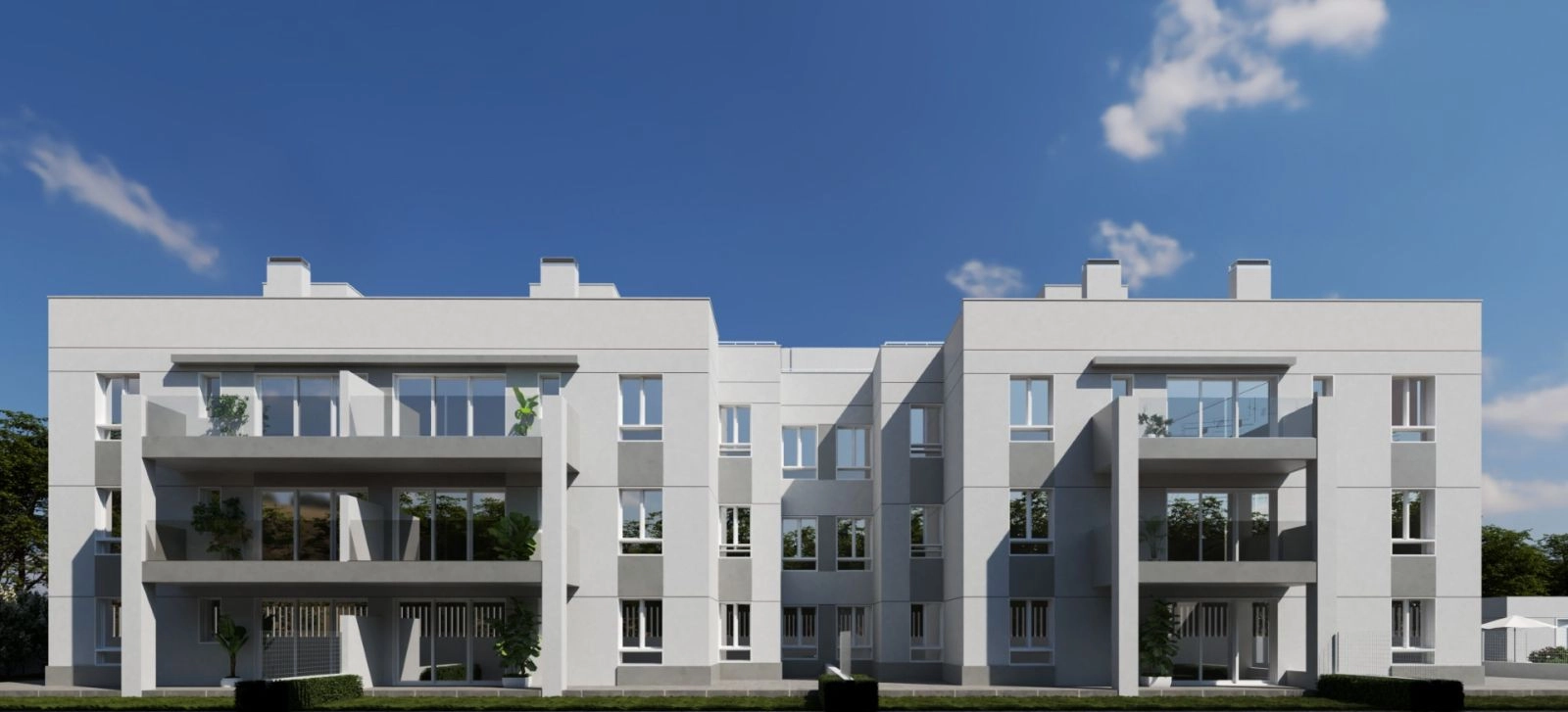 Die moderne Architektur des Gebäudes fügt sich harmonisch in die grüne Umgebung ein.