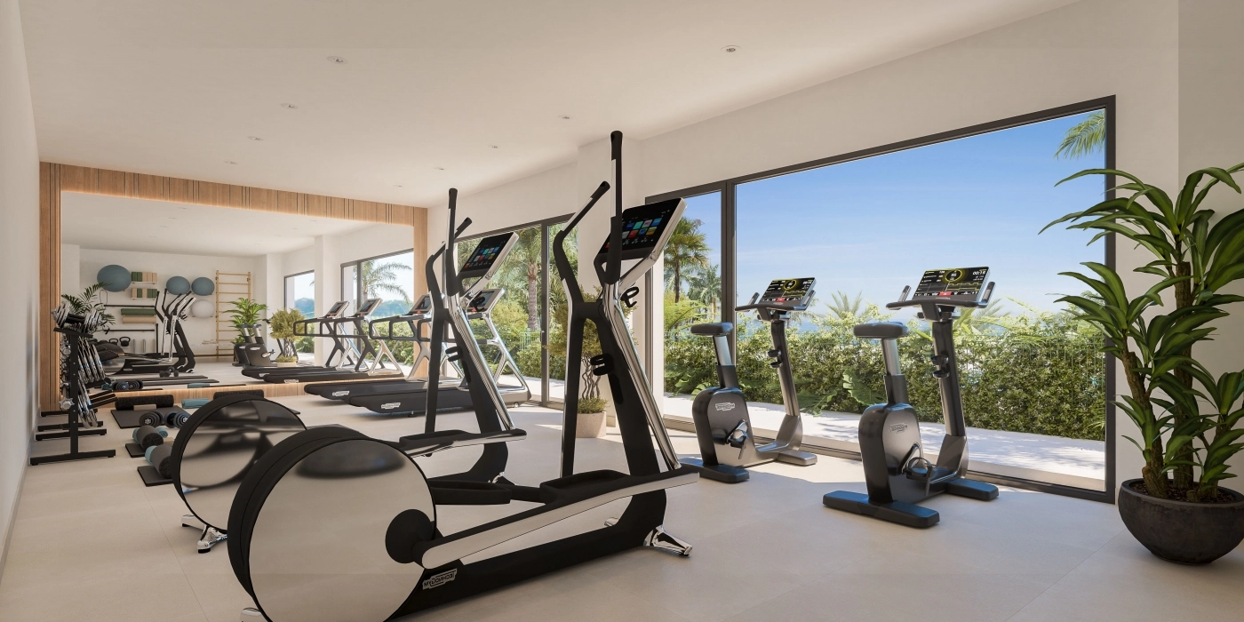 Ein hochmodernes Fitnessstudio mit modernen Geräten und Blick auf die Gärten.