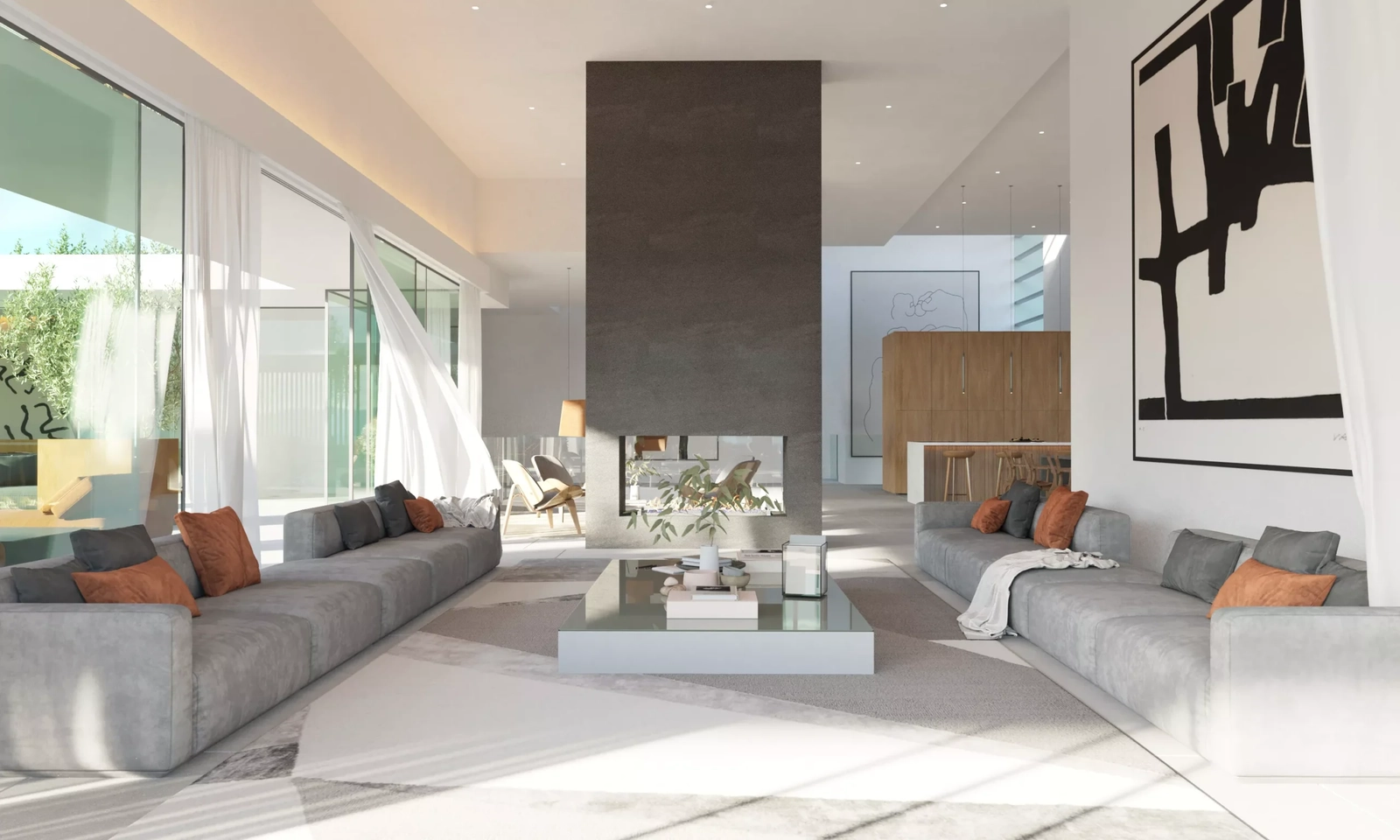 Ein zentraler doppelseitiger Kamin schafft eine warme und einladende Atmosphäre im offenen Wohnbereich.