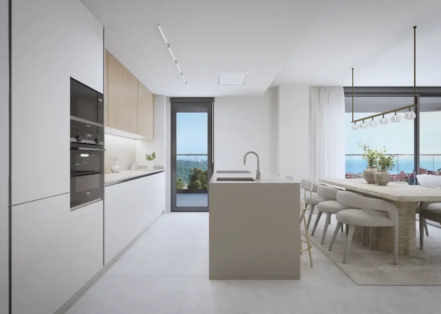 Eine moderne, voll ausgestattete Küche, die in den Wohnbereich übergeht und perfekt für Unterhaltung ist.