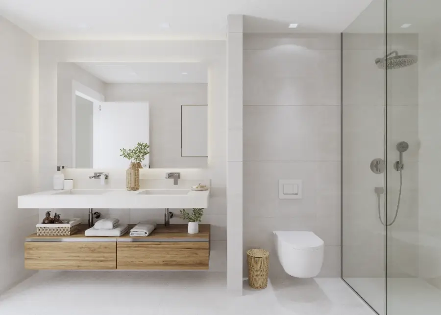 Ein stilvolles Hauptbadezimmer mit hochwertigen Oberflächen, Doppelwaschtisch und einer geräumigen begehbaren Dusche.