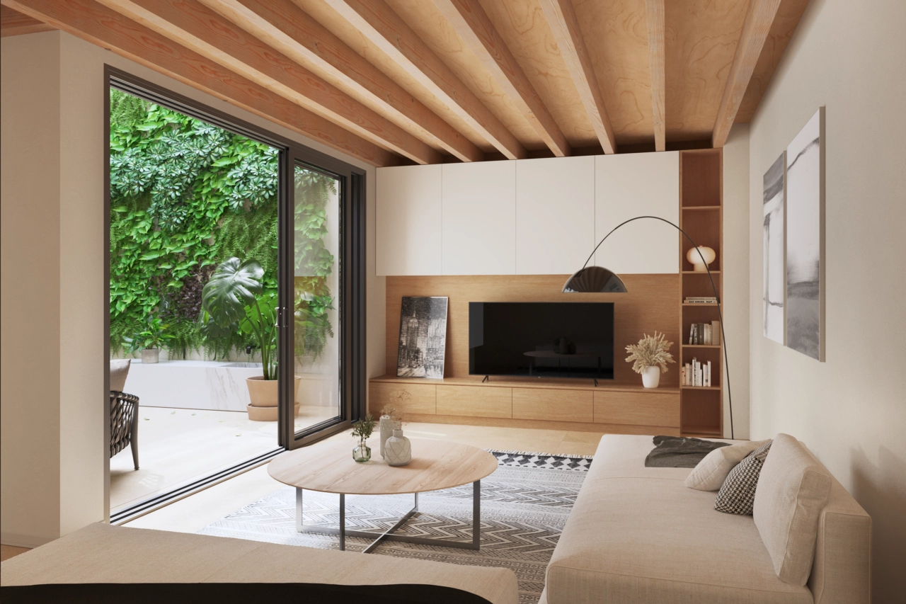 Ein stilvolles Wohnzimmer blickt auf den ruhigen Innenhof mit einer grünen Wand.