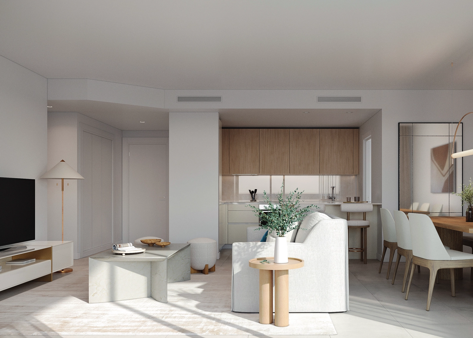 Helle und offene Wohnbereiche, die nahtlos ineinander übergehen und von natürlichem Licht durchflutet sind.